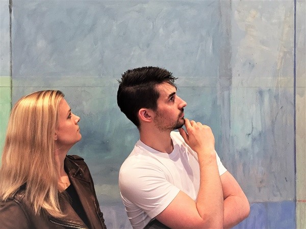 Madi and Zach in front of Richard Diebenkorn's 'Ocean Park #60' at the Anderson Collection at Stanford University